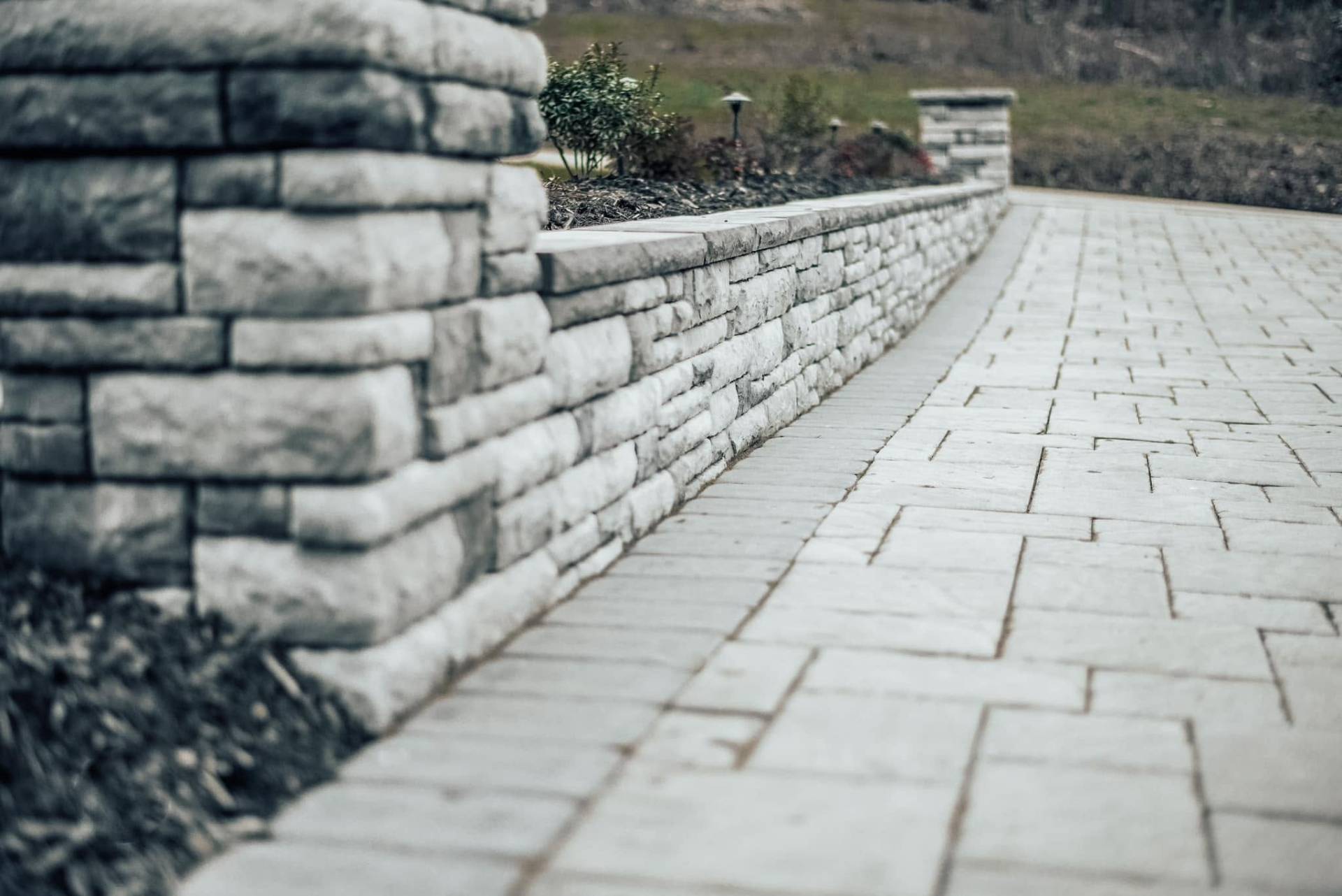 Custom retaining wall and paver walkway installation
